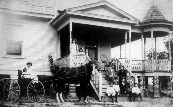 Photo of Scotland Harris house with family on porch
