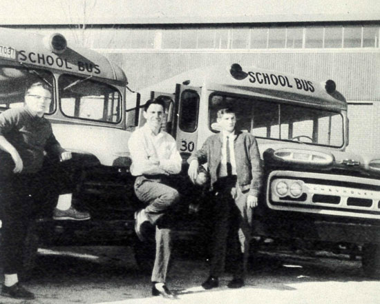 Bus drivers in front of buses